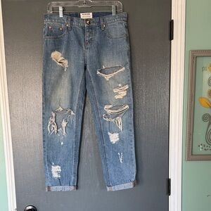 Free People Distressed Blue Jeans with cuffed ankles. Low waist medium rise